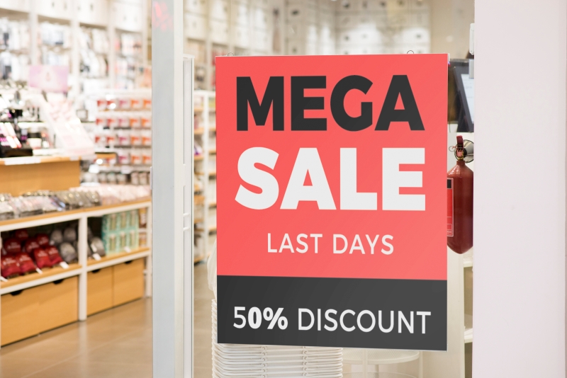 A sale sign in a retail store, informing customers of 50% discount