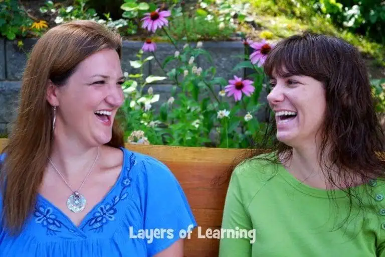 michellekaren-layersoflearning - Advanced Coupons Photo of Michelle and Karen, co-founders of Layers of Learning, smiling and sitting together outdoors